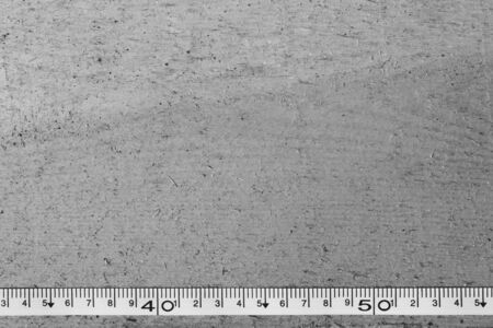 tape measure on the brown wooden background