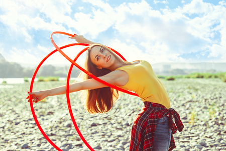 woman rotates on nature backgroundの写真素材