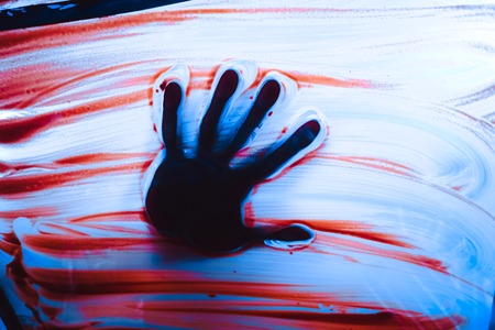 Handprint on dirty glass window abstract backgroundの写真素材