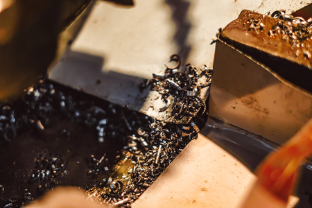 iron shavings in the workshop on the tableの写真素材