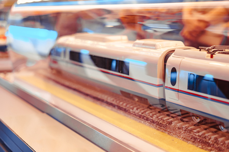 Miniature toy model of modern train crossing bridgeの写真素材