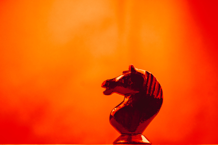 knight chess piece one standing in the backgroundの写真素材