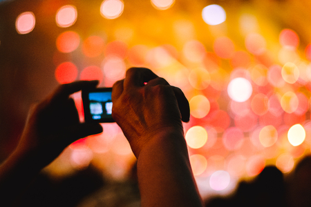 people shoot on the phone rock concertの写真素材