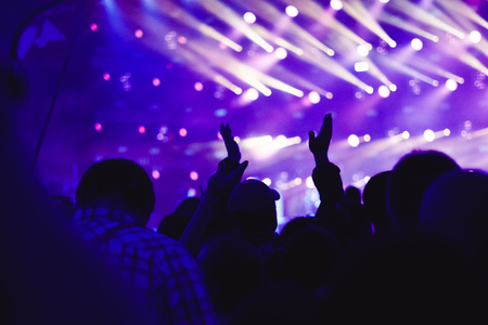 Effects blur Concert, disco dj party. People with hands up having funの写真素材