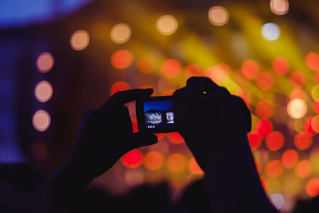 people shoot on the phone rock concertの写真素材