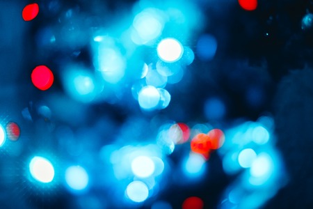 Background blur texture boke, violet, yellow, pink, six sides, round. Defocused abstract red christmas background dark toneの写真素材