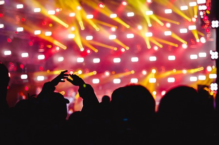 Effects blur Concert, disco dj party. People with hands up having funの写真素材