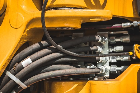 The hydraulic tractor is yellow. Crawler bulldozer at the exhibitionの写真素材