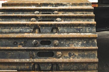 The hydraulic tractor is yellow. Crawler bulldozer at the exhibition