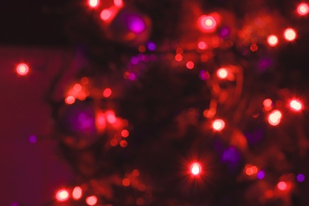 Background blur texture boke, violet, yellow, pink, six sides, round. Defocused abstract red christmas background dark toneの写真素材