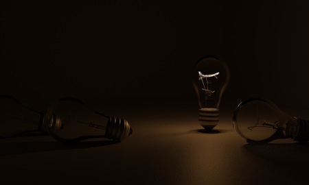 3D light bulb in the dark, a few light bulbs are not workingの写真素材