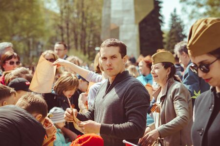 Russia, Siberia, Novokuznetsk - may 9, 2019: a lot of people at the celebration of victory day in...