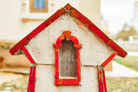 a small brick house in miniature of a small brick