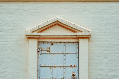 a window in an old building with a lattice set deep in the wall, the old Church