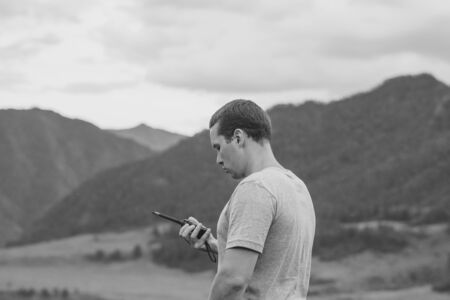 a man talking on the radio in the campaign against the mountains
