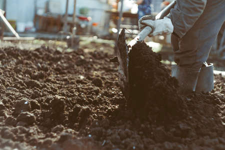 the man digs the garden