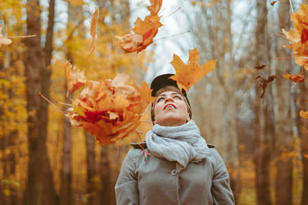 photo of a girl in the autumn forestの写真素材