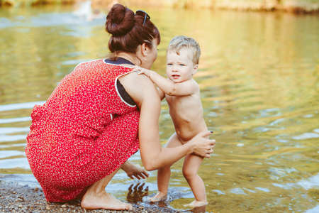 mother and son by the riverの写真素材