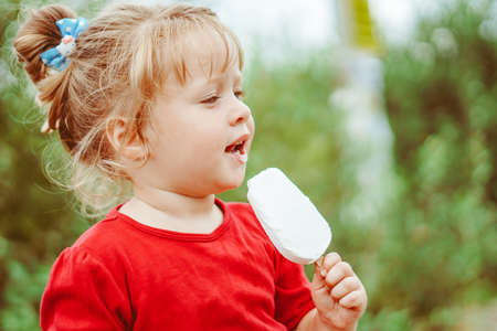 little girl with ice creamの写真素材