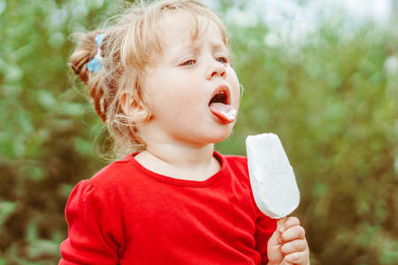 little girl with ice creamの写真素材