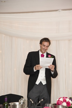 Groom making speech during wedding receptionの写真素材