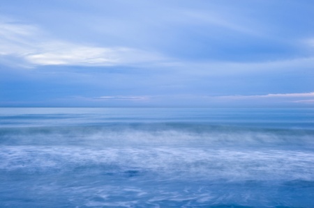 Long exposure of wave and tide coming into beachの写真素材