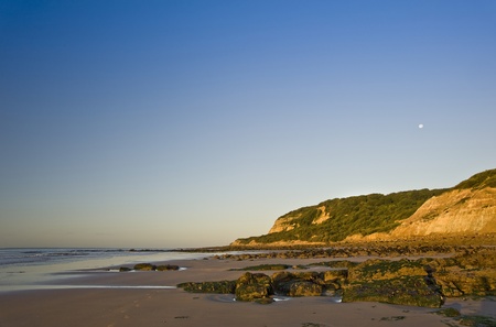 Beautiful view of beach at sunrise with rock detailsの写真素材