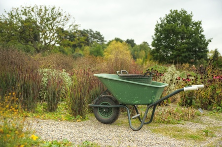 Peaceful scene with garden wheelbarrow in English country garden settingの写真素材