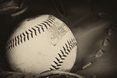 Vintage retro image of baseball and glove in old antique plate style of photographの写真素材