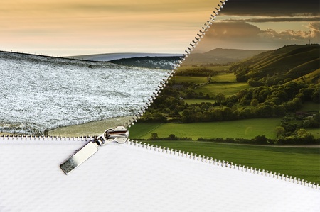 Open zipper showing Winter landscape scene changing to glorious Summer landscape with copy space at bottomの写真素材