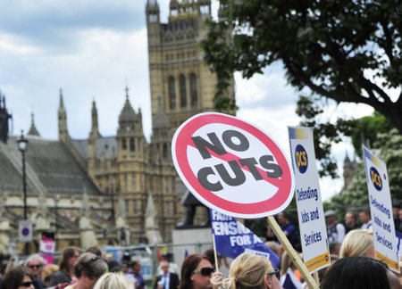 LONDON - JUNE 30; Unidentified members of various trade unions march during a general strike against government spending cuts during a protest organised by PCS and NUT trade unions in London on June 30, 2011 in London on June 30, 2011のeditorial素材