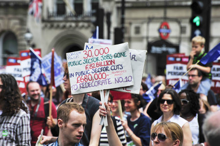 LONDON - JUNE 30; Unidentified members of trade unions make their feelings clear during a march...