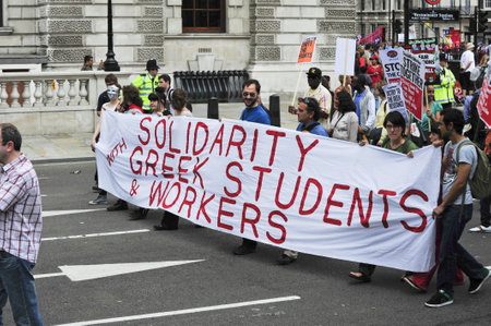LONDON - JUNE 30; Unidentified members of the Greek London community show their support against...