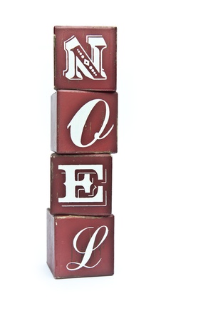 Noel spellt on wooden blocxks isolated on white backgroundの写真素材