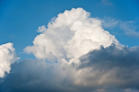 Beauttiful natural fluffy white cloud formations in blue skyの写真素材