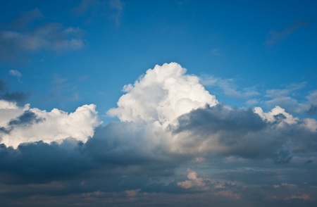 Beauttiful natural fluffy white cloud formations in blue skyの写真素材