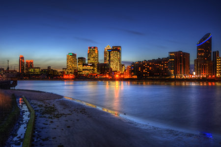 View of London City skyline at night on clear sky with reflections in River Thamesのeditorial素材