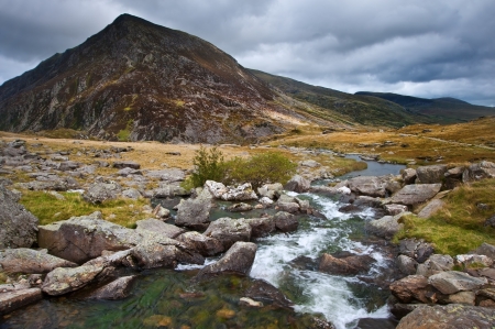 View over waterfall towards Pen-yr-Ole-Wen mountian in Snowdonia National Parkの写真素材