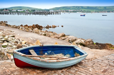 Rowing boat on slipway of old seaside townの写真素材