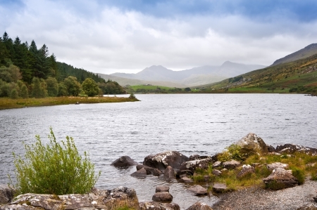 View along Llyyn Mymbyr in Snowdonia National Park toowards cloud coovered Mount Snowdonの写真素材