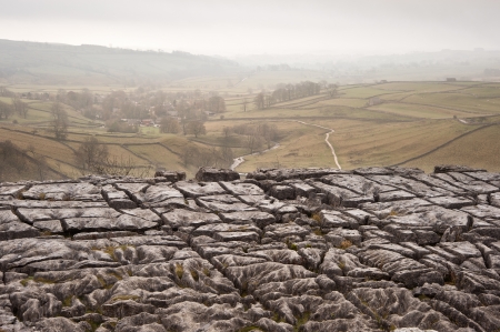 Autumn morning over liomestone pavement at Malham Cove looking along Malham Dale in Yorkshire Dales National Parkの写真素材