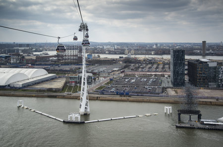 LONDON - APRIL 6: The Emirates Air Line cable in East London onApril 6, 2013 which has carried over...