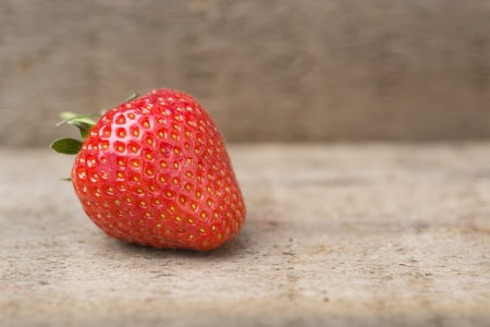 Fresh picked Summer strawberries on rustic wooden backgroundの写真素材