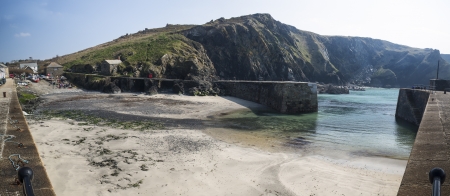 A traditional Cornish fishing village and harbor Cornwall Englandの写真素材