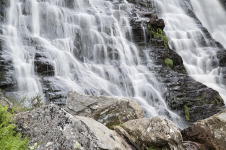 Landscape detail of waterfall over rocks in Summer long exposure blurred motionの写真素材