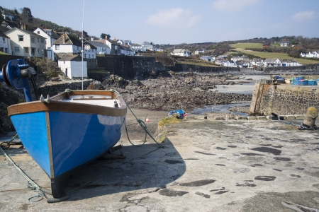 Harbour at low tide with fishing boats at Coverack Englandの写真素材
