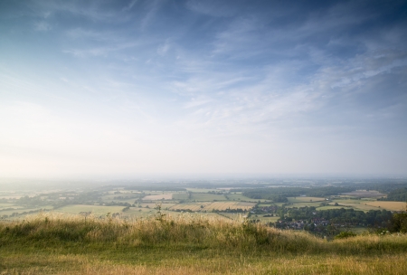 English countryside landscape during late Summer afternoon with dramatic sky and lighting