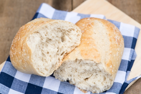 Sourdough loaf of bread in rustic kitched setting