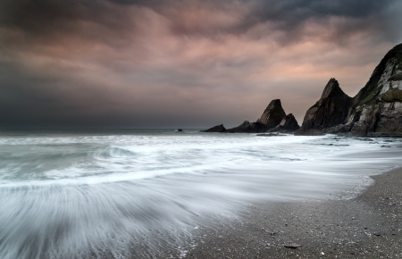 Rugged long exposure landscape seascape of rocky coastlineの写真素材