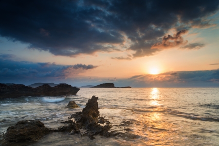 Dawn sunrise landscape over beautiful rocky coastline in Mediterranean Seaの写真素材